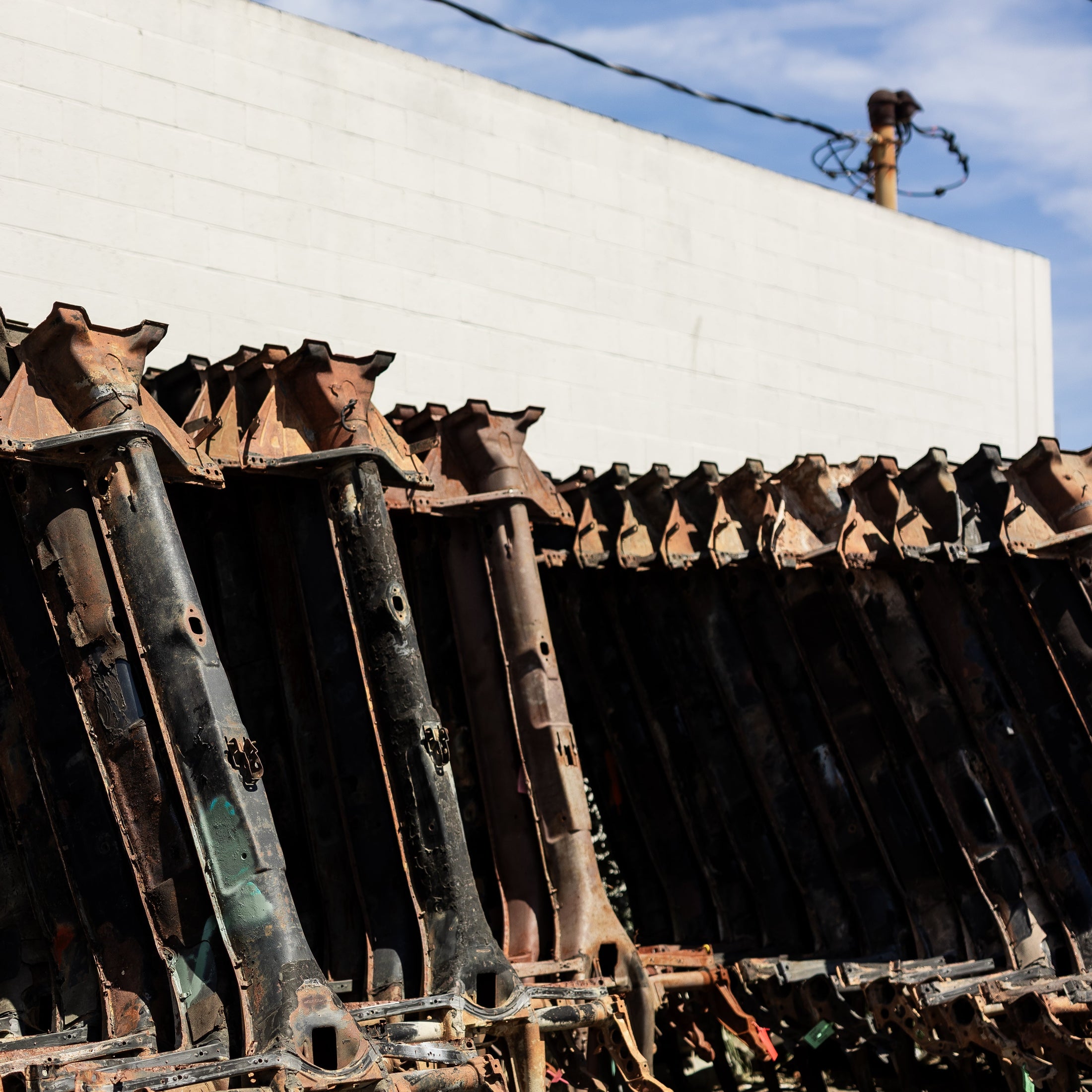 Row of air-cooled VW chassis at Washburn's Metal, Orange CA
