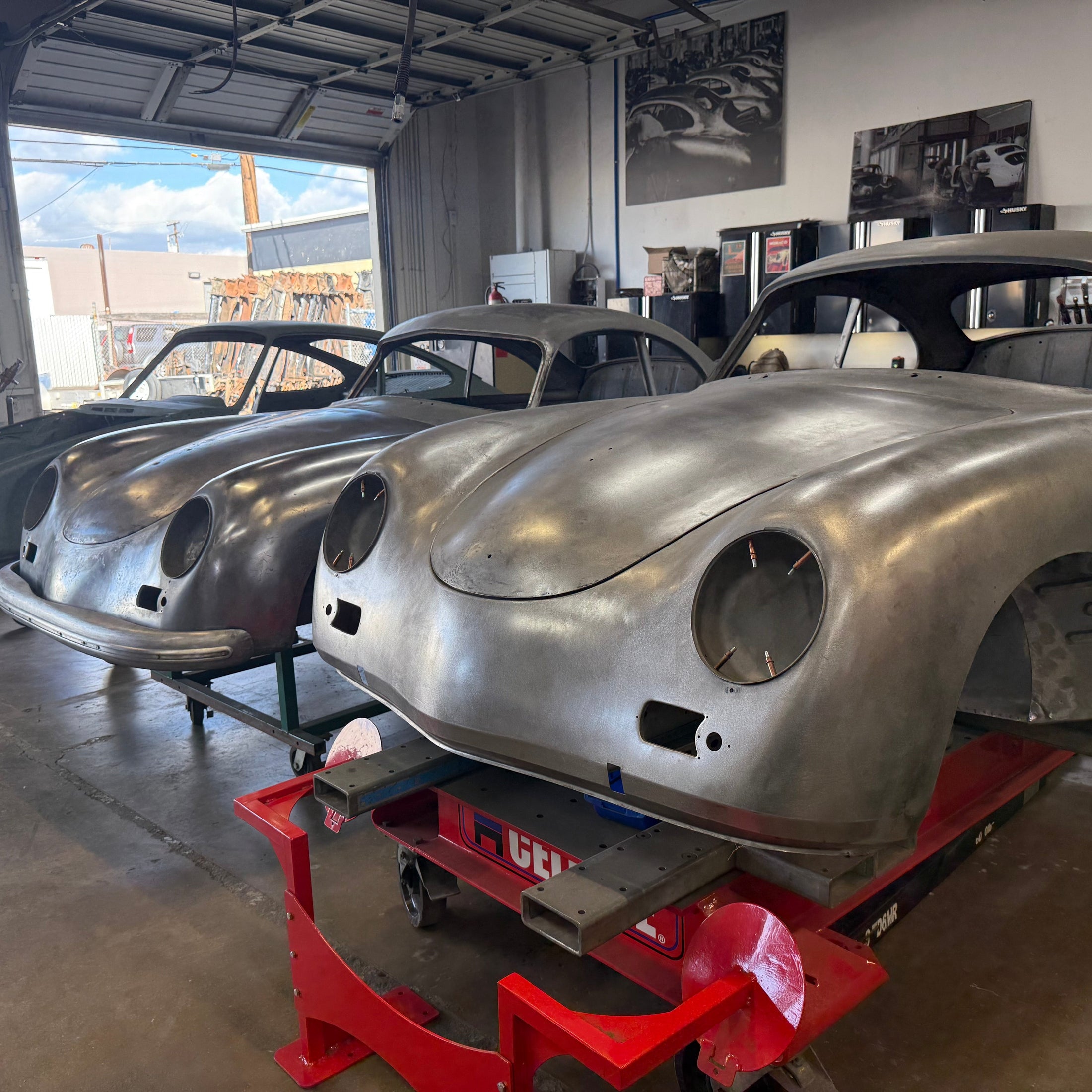 Blue VW Karmann Ghia in the build bay at Washburn's Metal, Orange CA