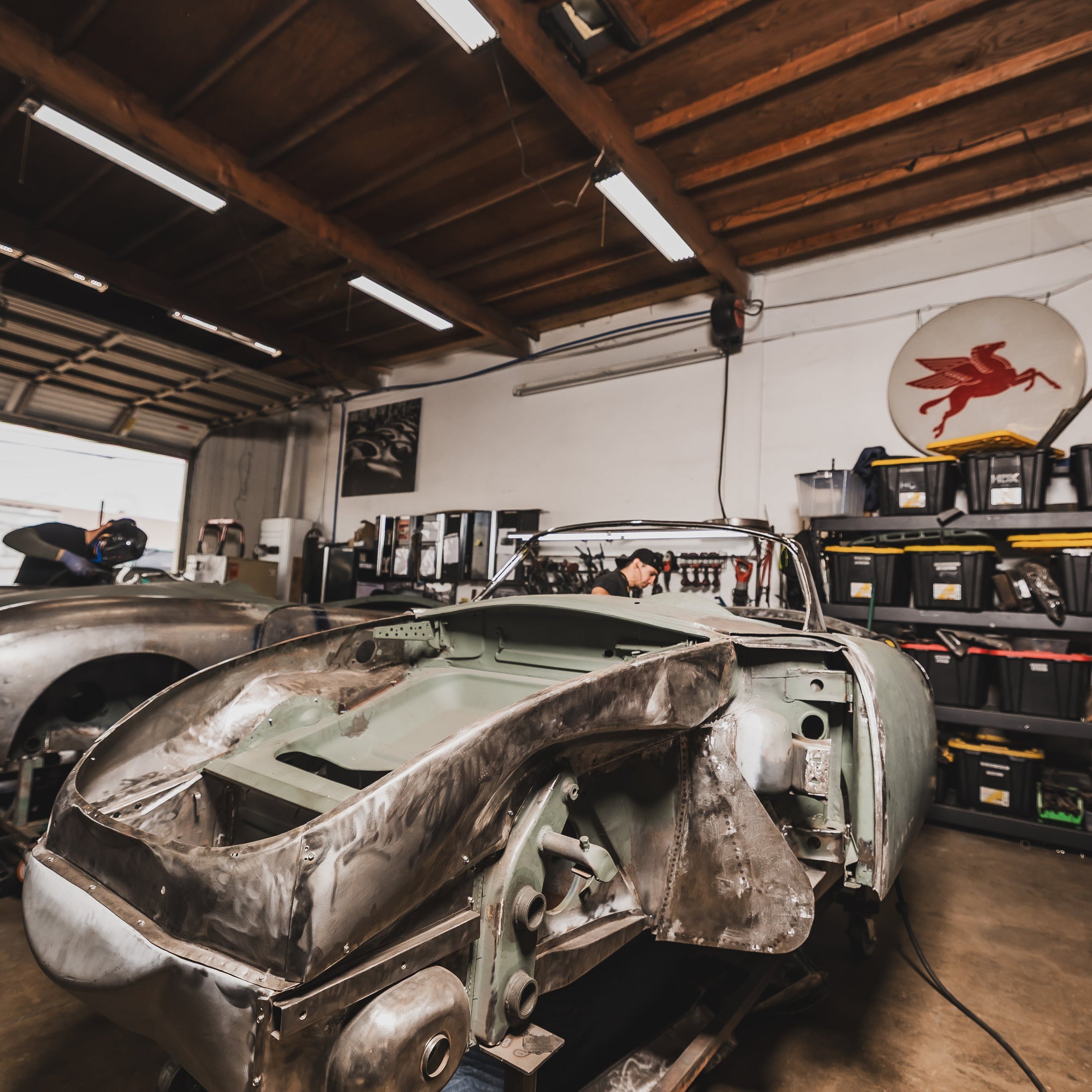 Three Porsche 356 bodies under restoration at Washburn's Metal, Orange CA