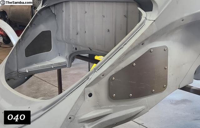 Washburn carb access panel installed in VW Beetle rear seal tray — engine bay clearance view