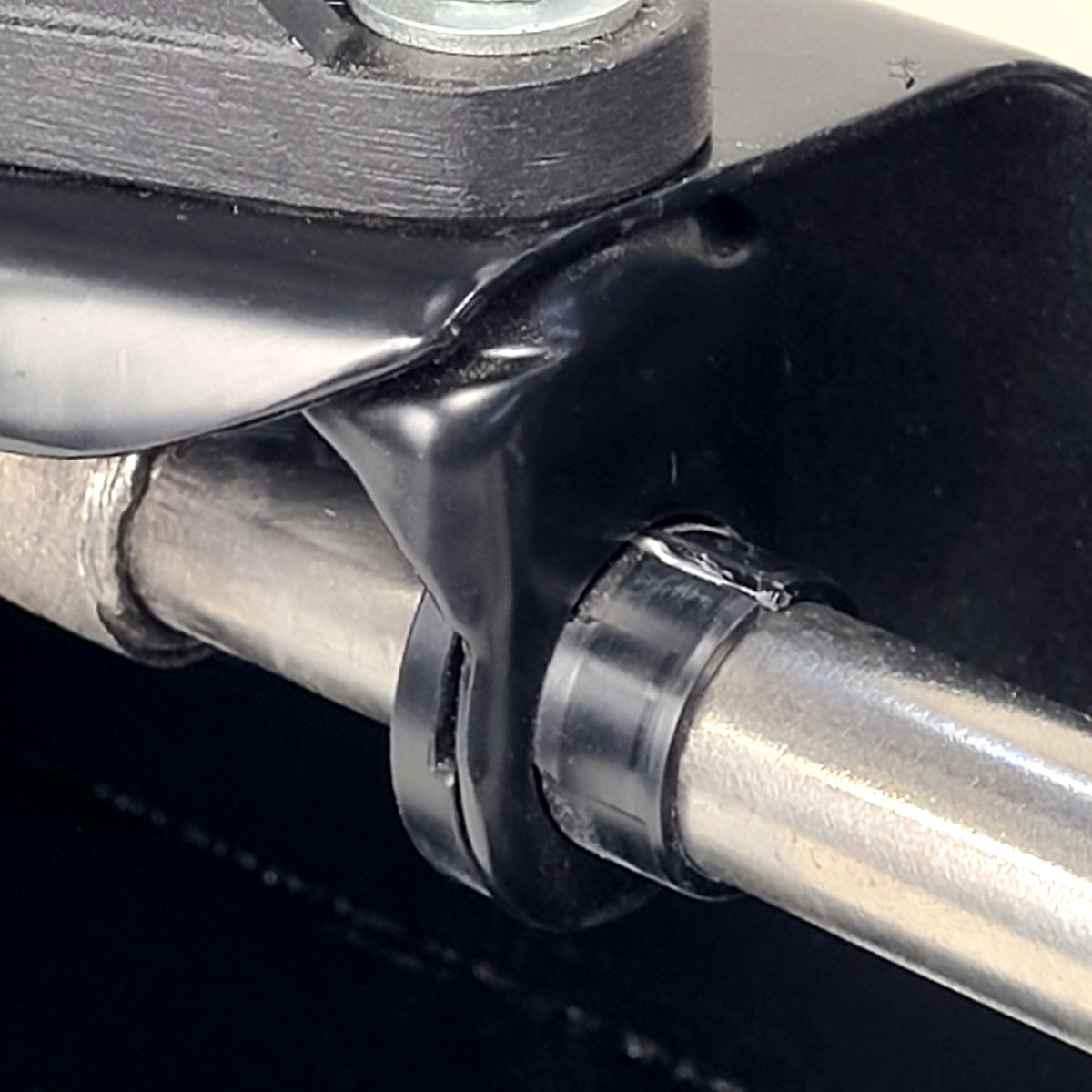Delrin shift bushing for VW Beetle Type 1 — alongside original shift rod hanger