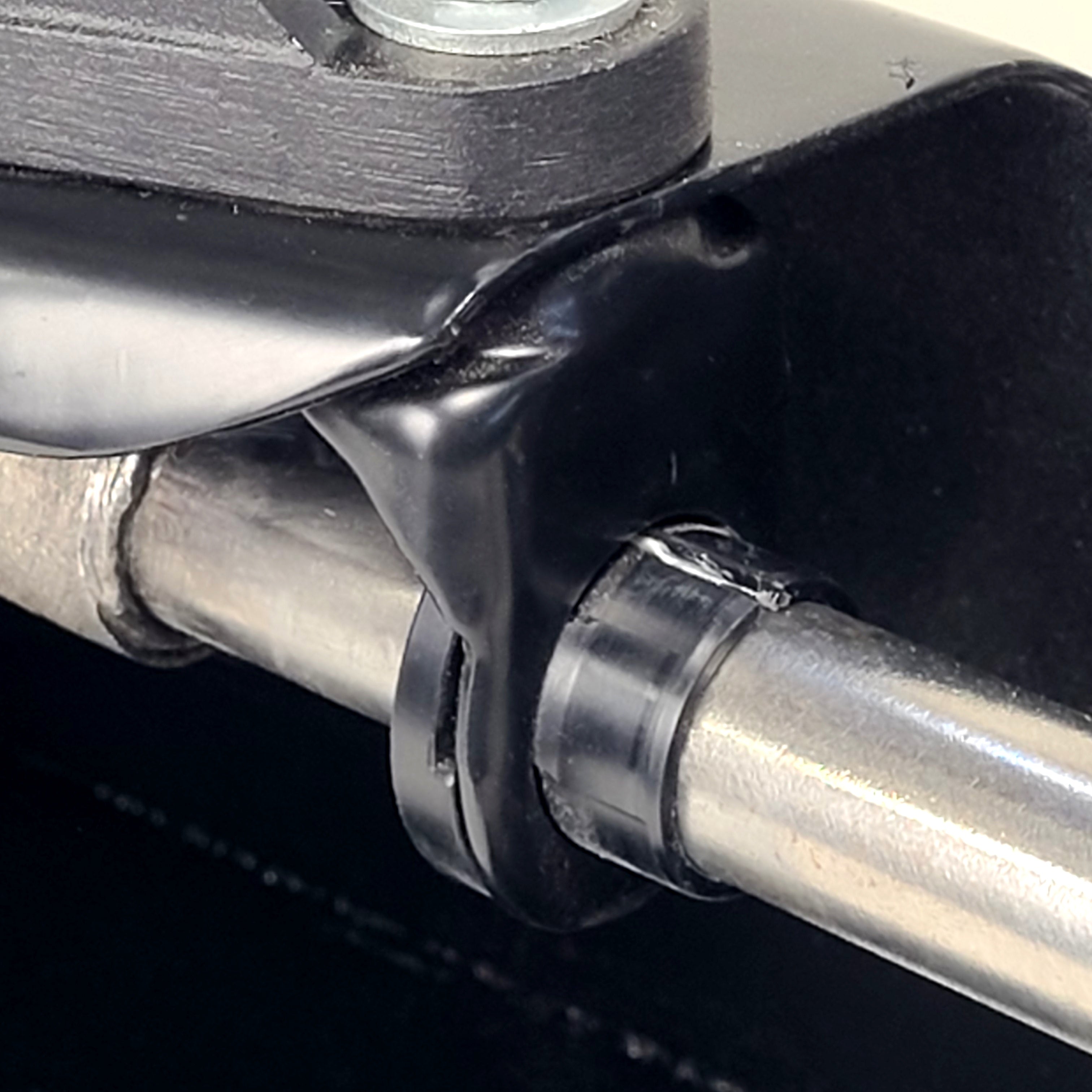 Delrin shift bushing for VW Beetle Type 1 — alongside original shift rod hanger