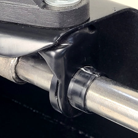 Delrin shift bushing for VW Beetle Type 1 — alongside original shift rod hanger