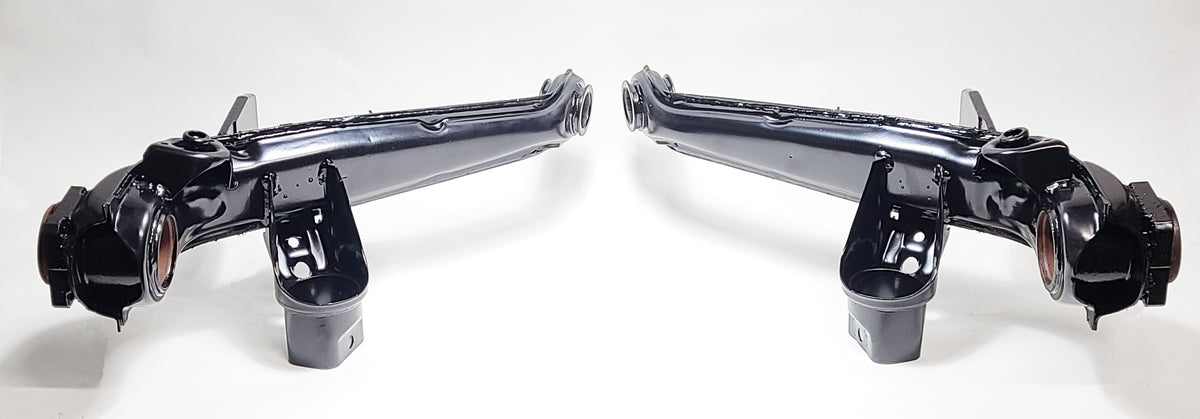 VW IRS trailing arm pair shown after refurbishment — German OEM cores ready for bushings