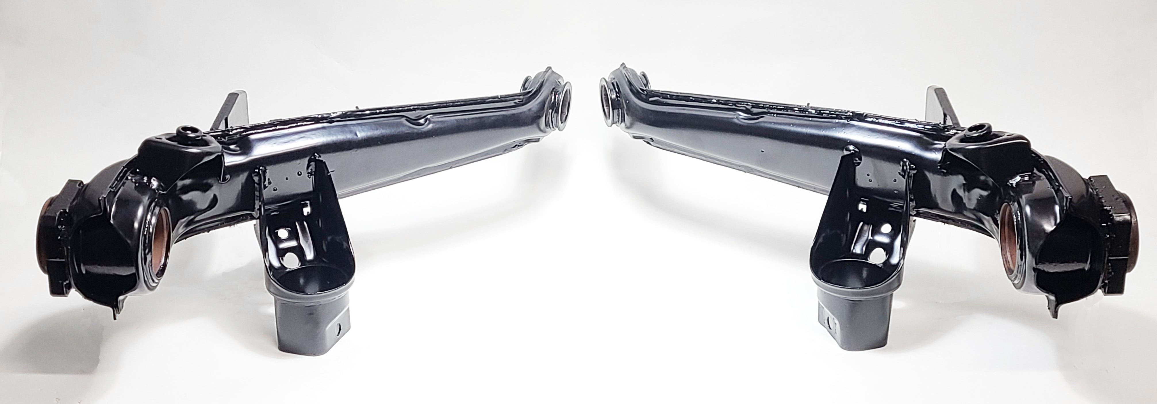 VW IRS trailing arm pair shown after refurbishment — German OEM cores ready for bushings