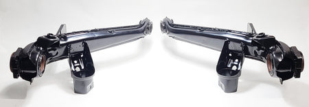 VW IRS trailing arm pair shown after refurbishment — German OEM cores ready for bushings