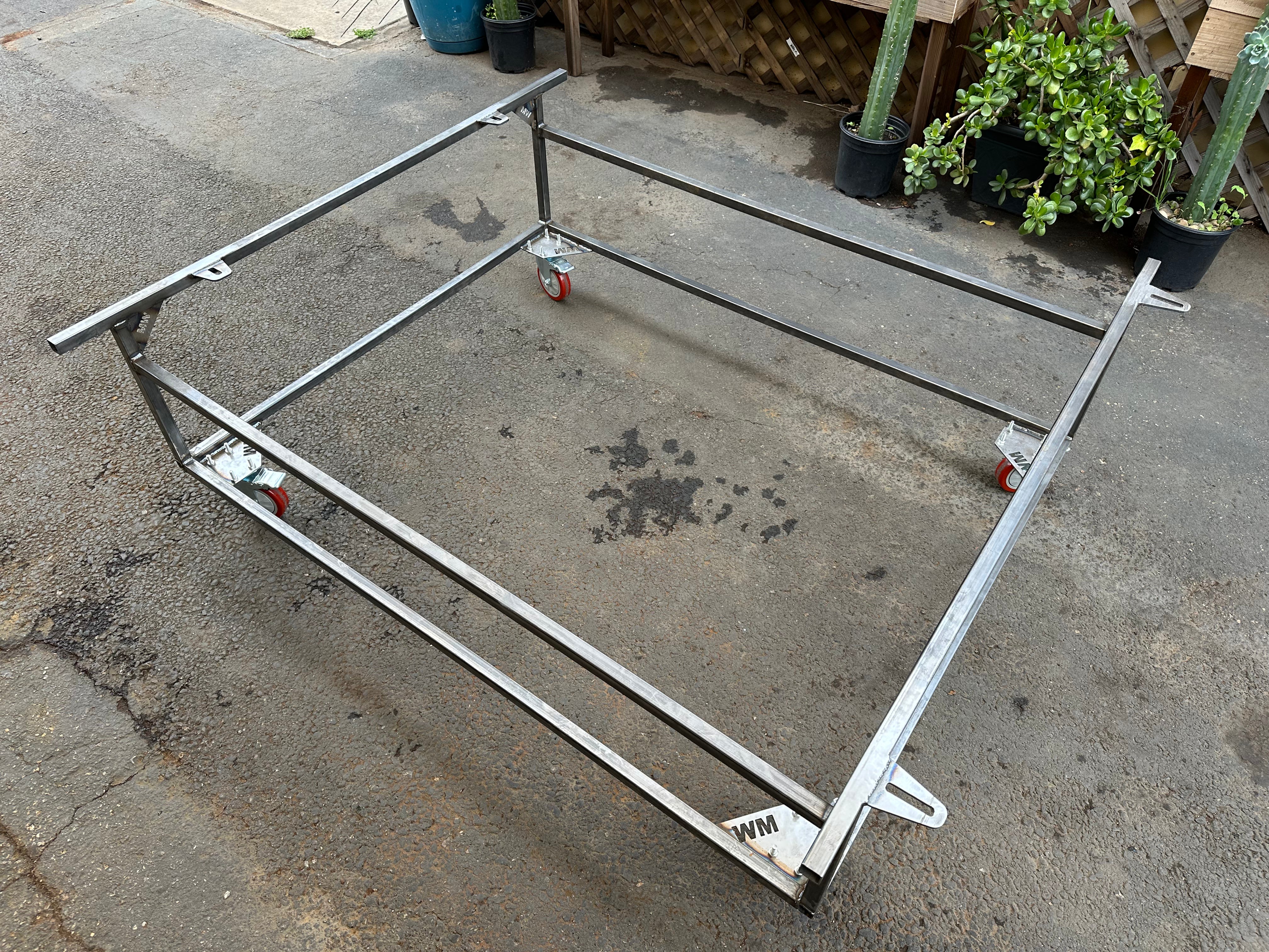 Body cart with VW Beetle pan and body separated for chassis work