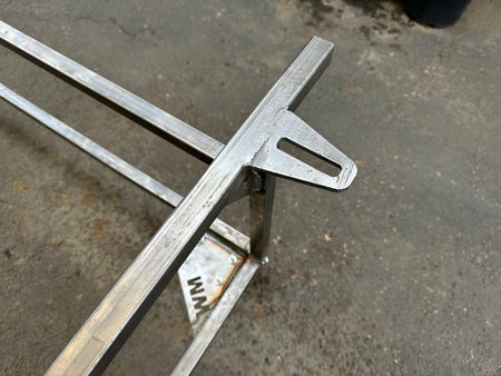 CNC-cut gusset detail on VW restoration body cart frame